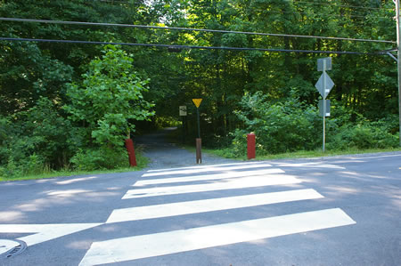 The trail crosses Barkely Dr. This road has lgiht traffic.
