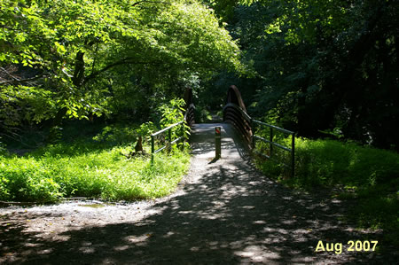The trail crosses a bridge over Accotink Creek.
