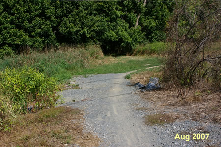 The trail crosses a drainage ditch.