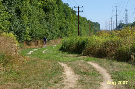 The trail turns right to follow the power lines.
