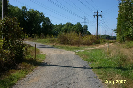 After passing the power station a trail intersects on the right. Take the trail to the right to stay on the CCT as it follows the power lines. Take the trail to the left to follow an unofficail alternate route. Go to step 30 in the directions for the alternate route.