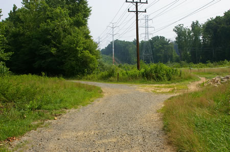 After passing the power station a bicycle trail intersects from the right. Turn left to stay on the CCT.