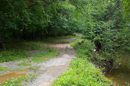 The trail follows Accotink Creek on the right.
