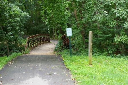 The trail passes a CCT marker prior to crossing a bridge over a creek. However, this is not the CCT.