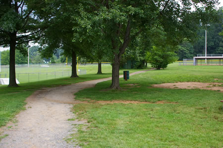 Take the trail from the front of the building with the ballfield fence on the left.