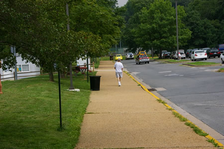 Follow the sidewalk to the end of the parking lot with the skateboard ramps on your left.