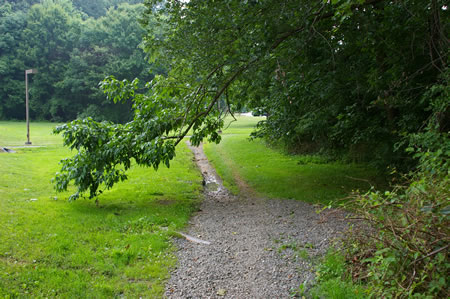 The trail passes along the side of the tennis courts.