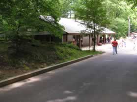 At the other end of the parking lot turn left to follow the service road.  Walk past the train station on the left.