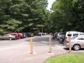 Turn slightly to the right after passing the park office service road to return back to the playground parking lot.