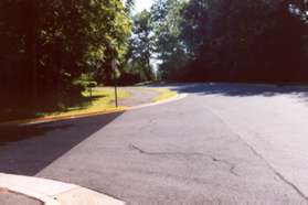 The trail crosses Woodcrest Dr continuing along Autumn Ridge Circle.