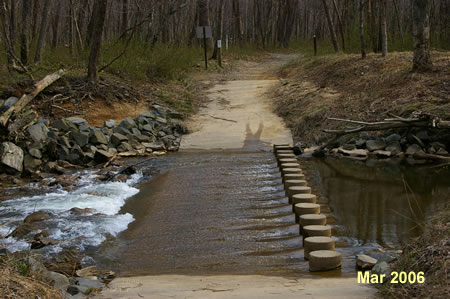 The path crosses Difficult Run using columns.