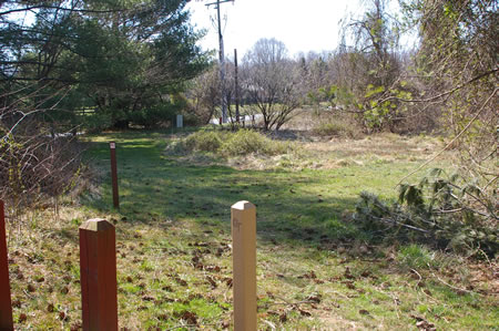 Starting from the crosswalk in Leigh Mill Rd turn left at the marker and then right to follow the trail within the meadow.