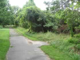 Follow the asphalt trail with the homes on the left.  You will pass a tennis court on the right.