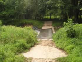 The trail crosses Difficult Run on columns.