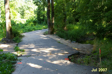 The creek crosses under the path twice in this section.