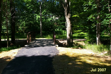 After crossing the bridge turn right to follow the asphalt trail. This bridge was added in 2007.