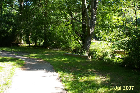 Pass by a trail leading to a bridge that was destroyed by floods in June 2006.