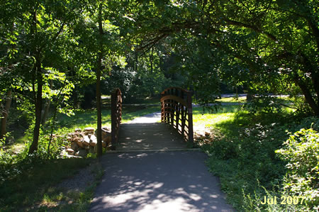 The trail crosses the creek on a bridge.
