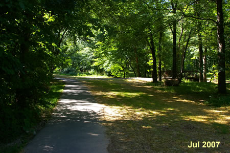 A trail intersects from the right.  Stay straight on the present trail.