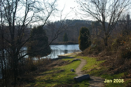 The trail passes through a Frisbee golf course and goes down to a pond.