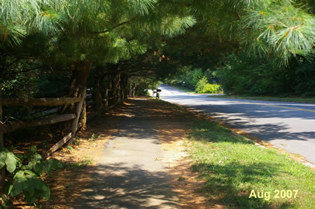 The trail is a narrow asphalt path along Glade Dr.