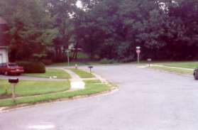 Follow the sidewalk to the left at Weybridge Ln.