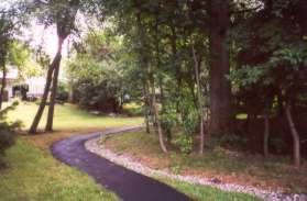 Cross Great Meadown Lane and follow the narrow path on the other side.