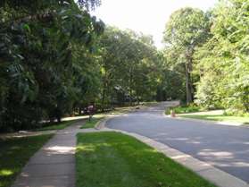 Turn right upon reaching Old Quincy La. to follow the sidewalk along that street.