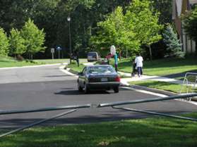 Take the concrete sidewalk along the right side of Tunwell Stable Ct.