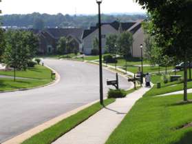 Turn right at Hunter Gate Wy and follow the sidewalk along that road.