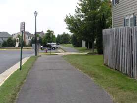 Stay on the asphalt trail after it crosses the street and enters a field.