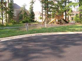 At the end of Turnwell Stable Ct. take the grass path behind the vehicle barrier to the left of the playground equipment.