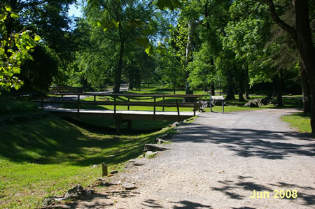 Turn left at the first intersecting trail to cross a bridge over the old canal bed.