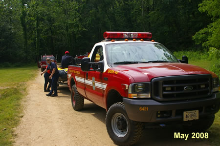 These are members of the Great Falls fire department waiting for other crew members to do a pracitce run on the Potomac.
