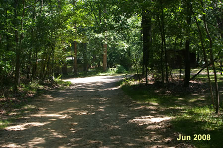 A trail intersects from the right.  Keep to the left on the present trail.
