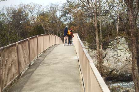 You will quickly come to the first bridge over one of the Potomac River passages.  The bridge railings may be removed to prevent damage during floods.