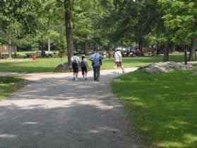 A trail branches to the left.  Continue on the present trail as it turns slightly to the right.  The visitor center should be in view.