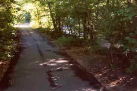 On the other side of the bridge take the asphalt trail to the right along Sugarland Run.