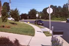 Turn right and follow the sidewalk along Kingstream Circle.