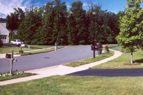 Turn right and follow the sidewalk along Huntsman Pl.