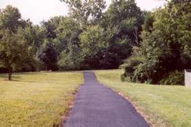 After crossing Eddyspark Dr the trail goes between the houses.  Turn right at the next trail intersection.