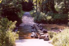 The trail crosses Sugarland Run on columns.