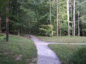 After a short distance an asphalt trail intersects from the right.  Continue straight on the present trail.