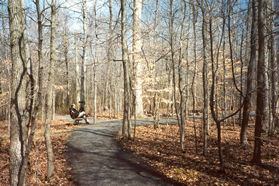 The gravel trail winds in a half loop. Turn right at the next gravel trail intersection.