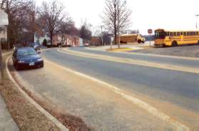 The sidewalk passes Kings Glen School.