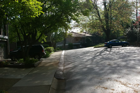 Turn left at the first sidewalk on the left in front of another group of homes.  This is Greenbriar Ct.