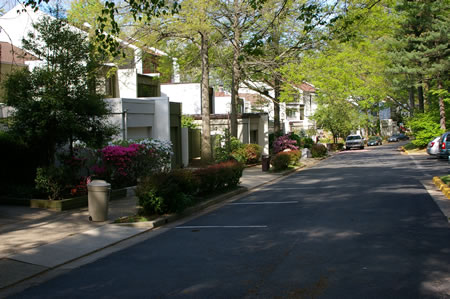 Turn right and follow the sidewalk along Waters Edge Ln.