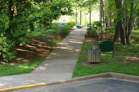 Walk up the sidewalk on the right of the end of Waters Edge Ln.