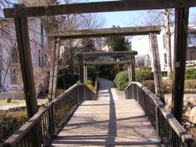 Turn left to cross the bridge and walk straight up the hill on the other side.