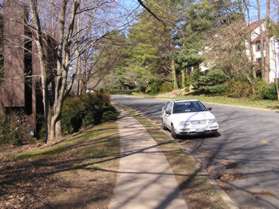 At the next street intersection (Inlet Ct.) turn left to follow the sidewalk along that street.